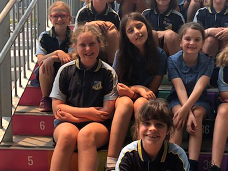 Harriet Coates (front) at school with her friends