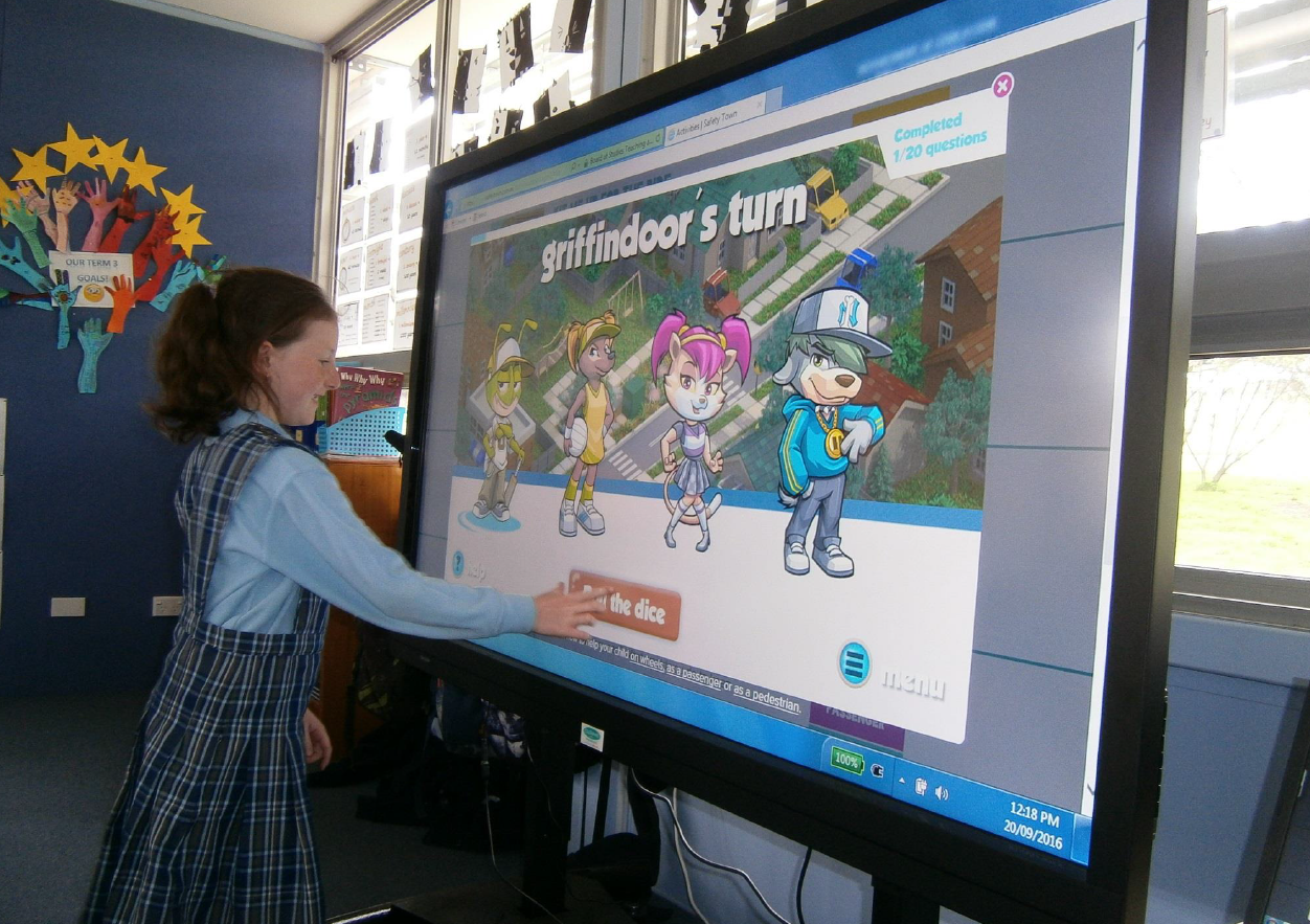 A student using the interactive board.
