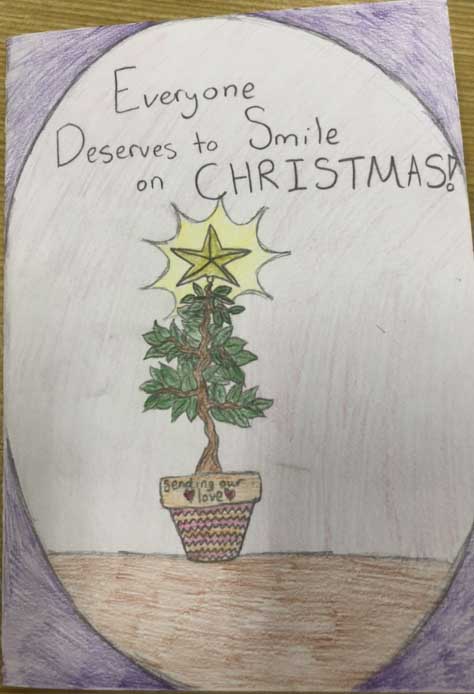 Christmas card saying Everyone deserves to smile