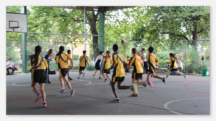 Students playing basketball at Fairvale High School.