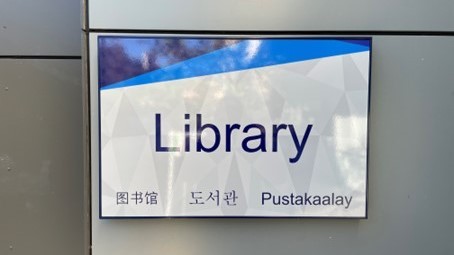Sign indicating library in different languages at Epping Public School