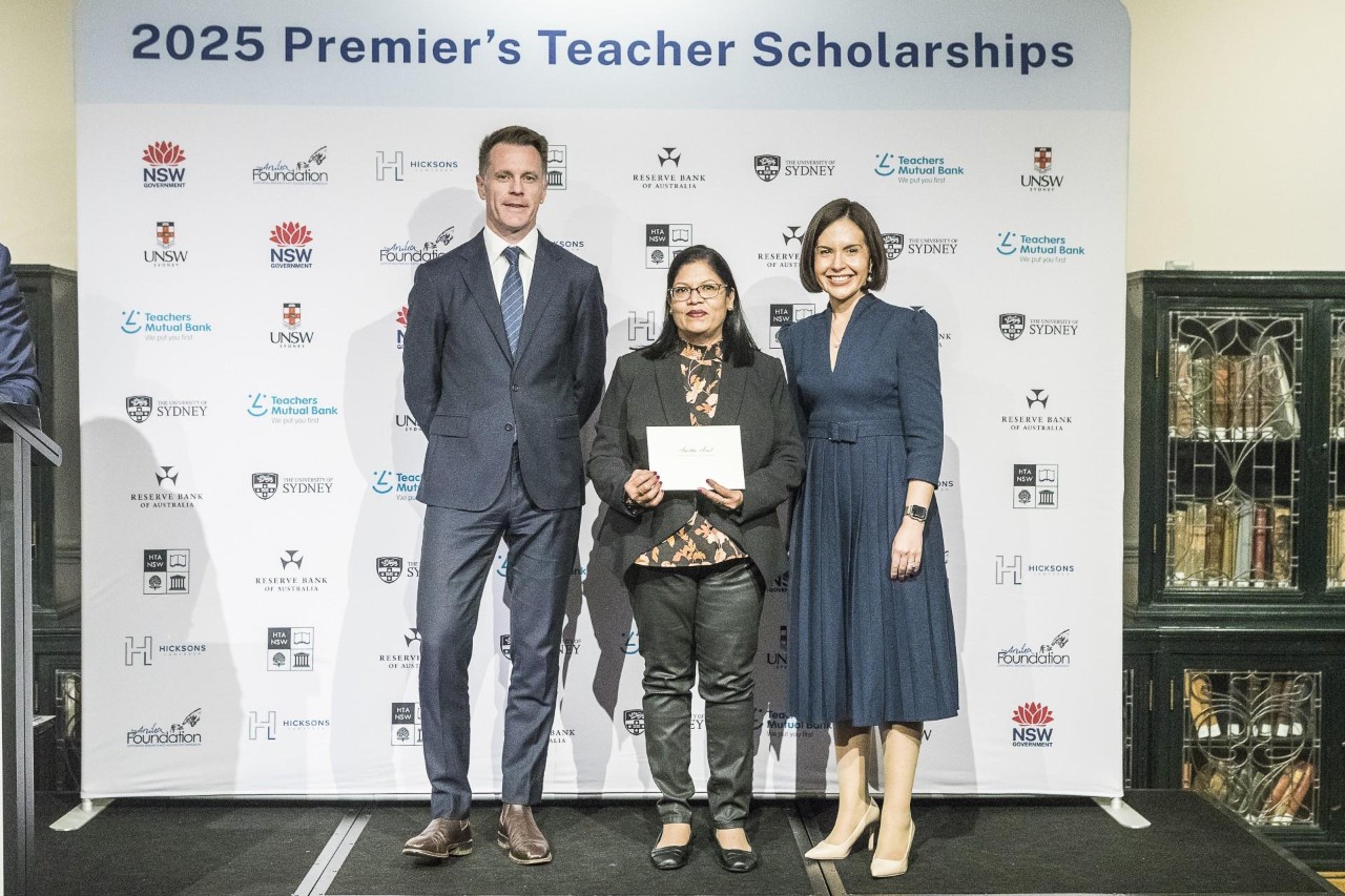 NSW Premier Chris Minns and Deputy Premier Education Prue Car standing with Anitha Arul