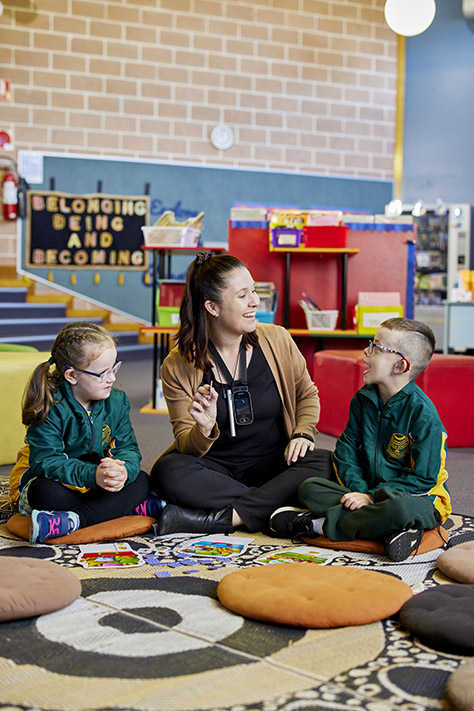 Students in the school library with a teacher.