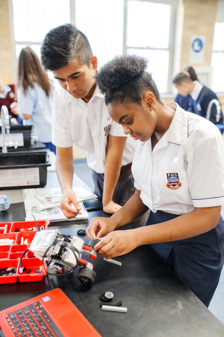 Two students working together in class.