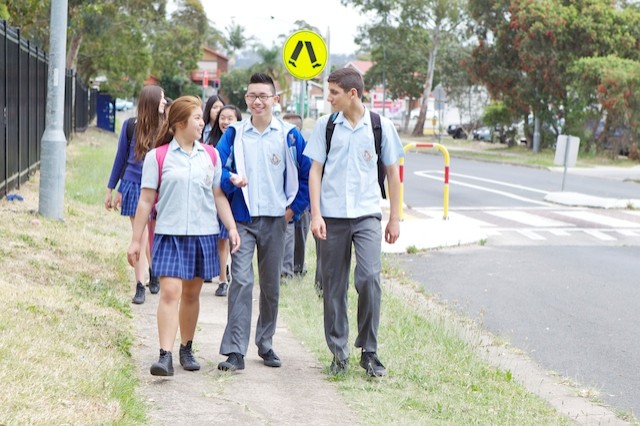 Students walking into high school.