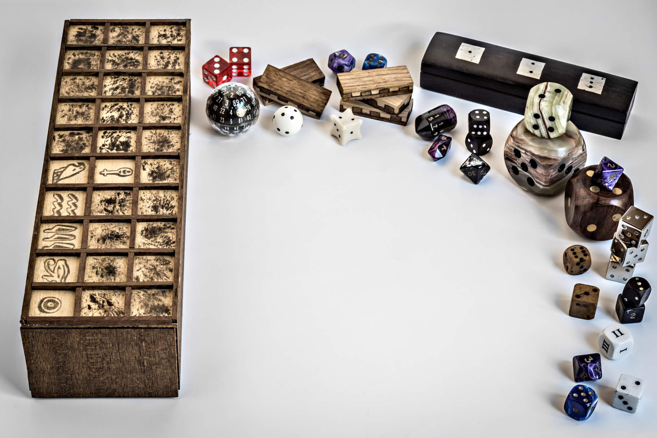 Wooden game board with assorted counters and dice around it