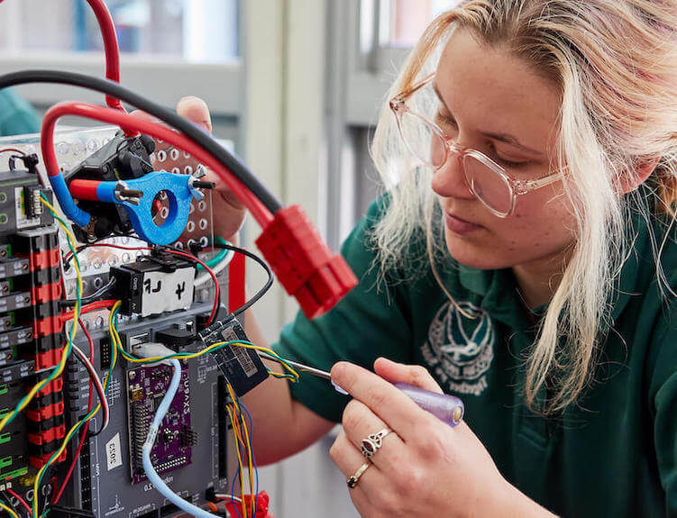 A student working on a robot.