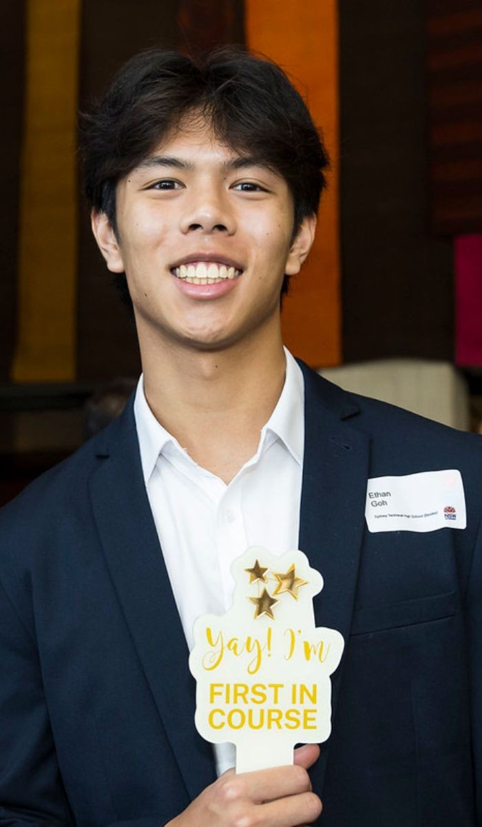 A student holding a sign.