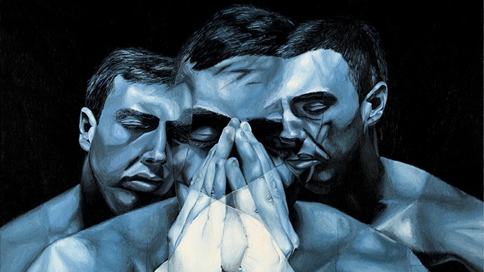 An artwork depicting three different emotions on the fact of a man