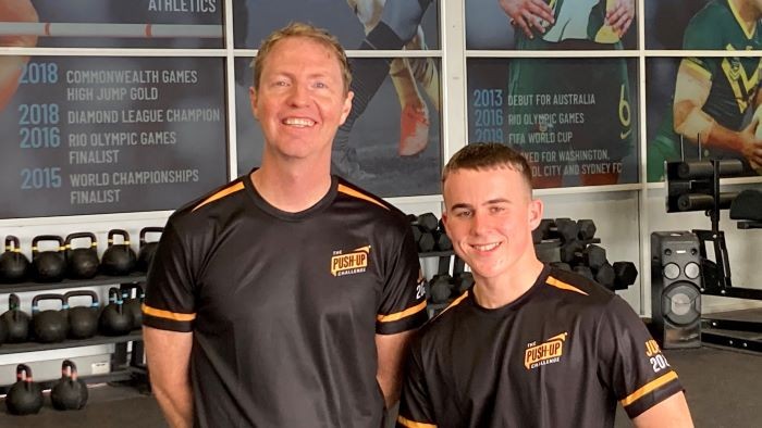 Push-Up Challenge CEO Nick Hudson next to Hills Sports High School star fundraiser Jayden Brien