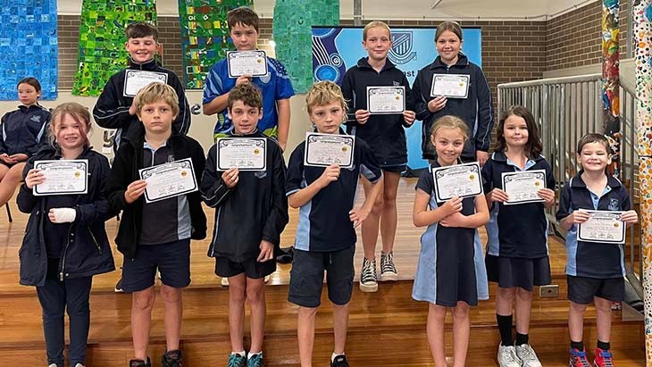 Students from Kempsey East Public School posing with awards.