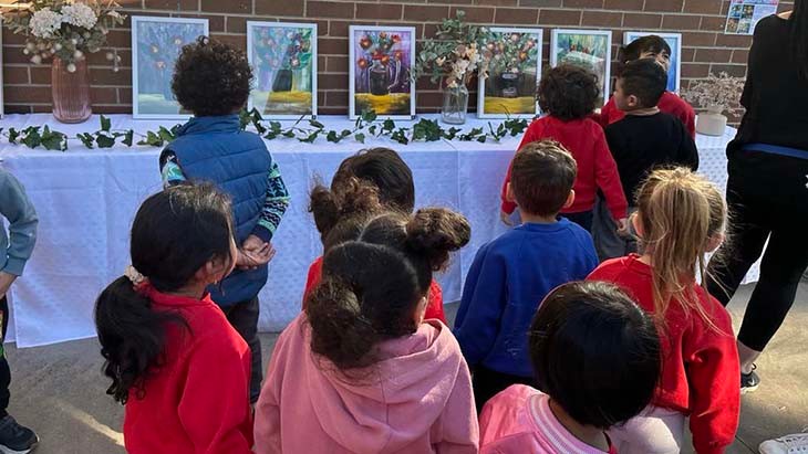 Students looking at artworks.