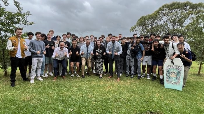 A group of people giving the camera a thumbs up