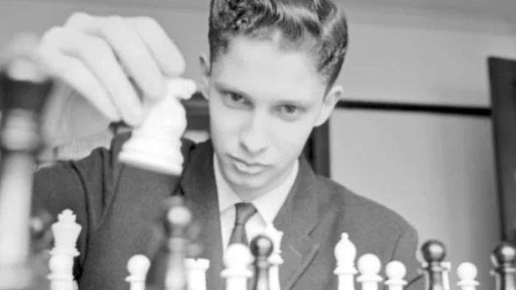 A boy playing chess.