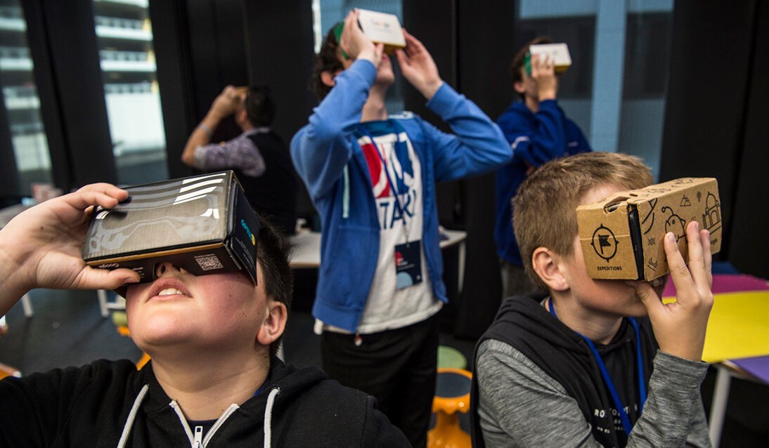 A group of student wearing virtual reality headsets.
