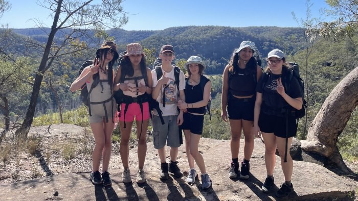 A group of students out on a hike in the bush