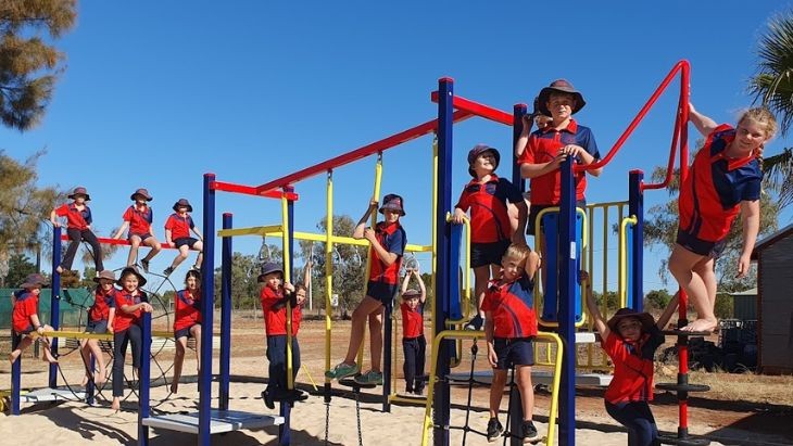 Students on play equipment.