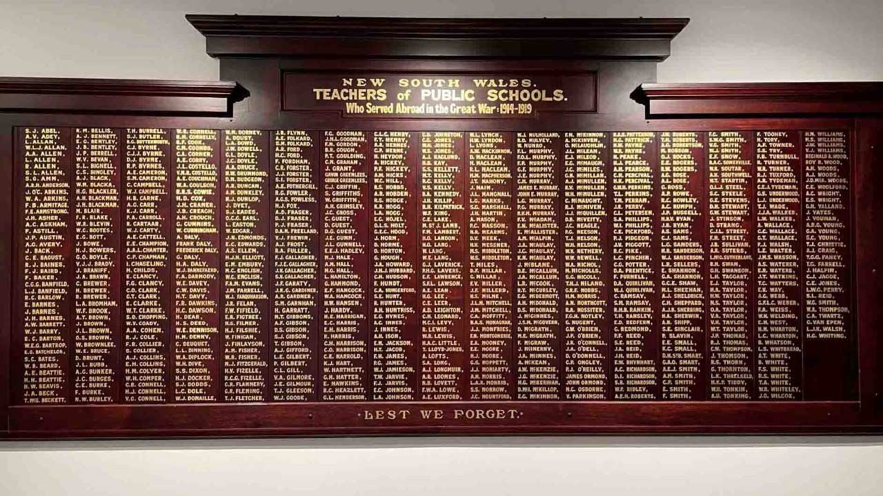 Brown honour board with gold lettering for names