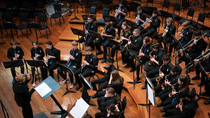 Students playing in an orchestra.