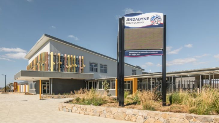 A sign outside a new school building.