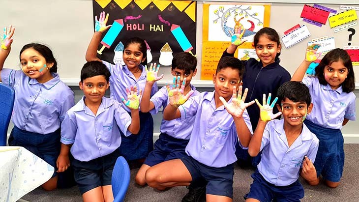 Students showing painted hands.