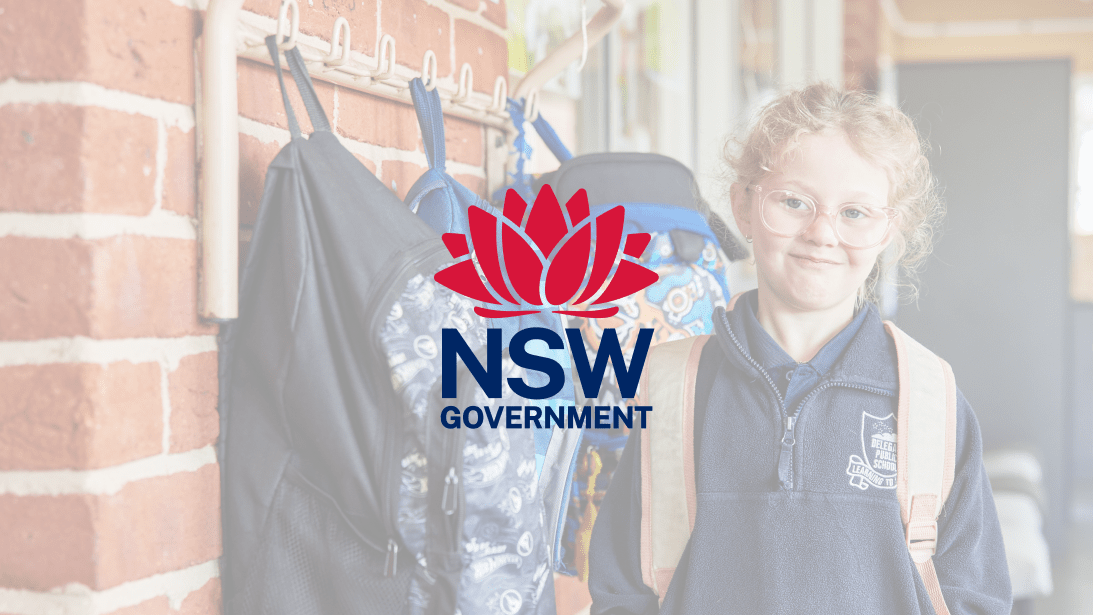 The NSW Government logo overlaying a photo of a young girl standing next to some bags on a wall.