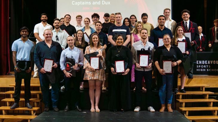 A group of people holding certificates.