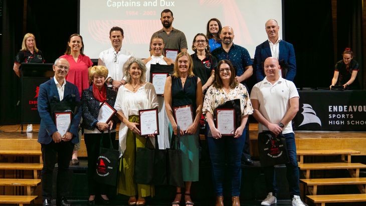 A group of people holding certificates.