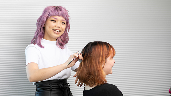 Girl with purple hair hairdressing