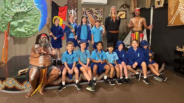 Students and staff with local Aboriginal performers.