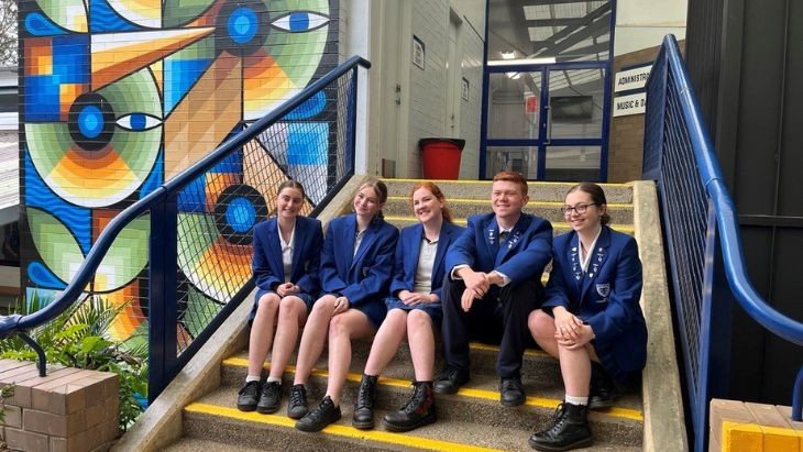 Students sitting on stairs.