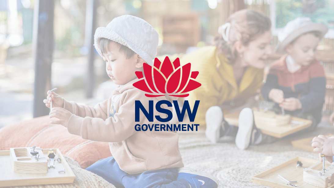 The NSW Government logo overlaying a photo of a young boy playing with toys.