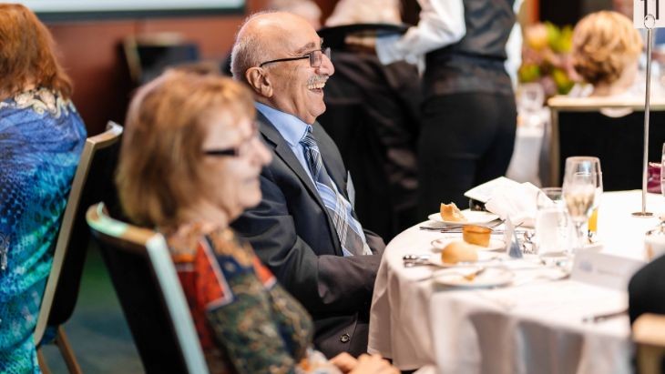 A woman and a man sitting at a table.