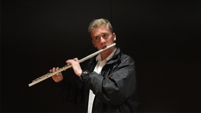 A male playing the flute