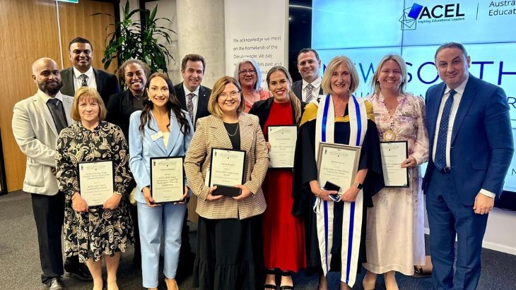 Men and women holding certificates.