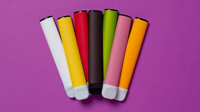 A group of vaporisers used for vaping, looking like coloured markers.