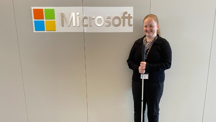 Christine standing in front of Microsoft sign