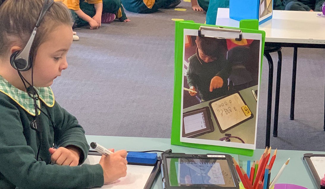 A student using a iPad in the classroom.