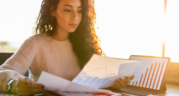 Female student looking at notes.