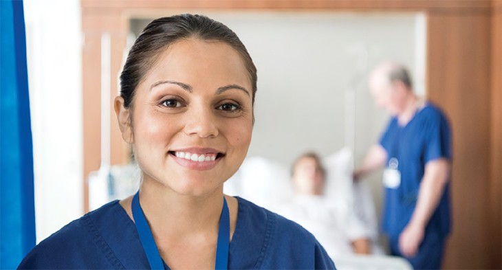 Female health care worker smiling at camera