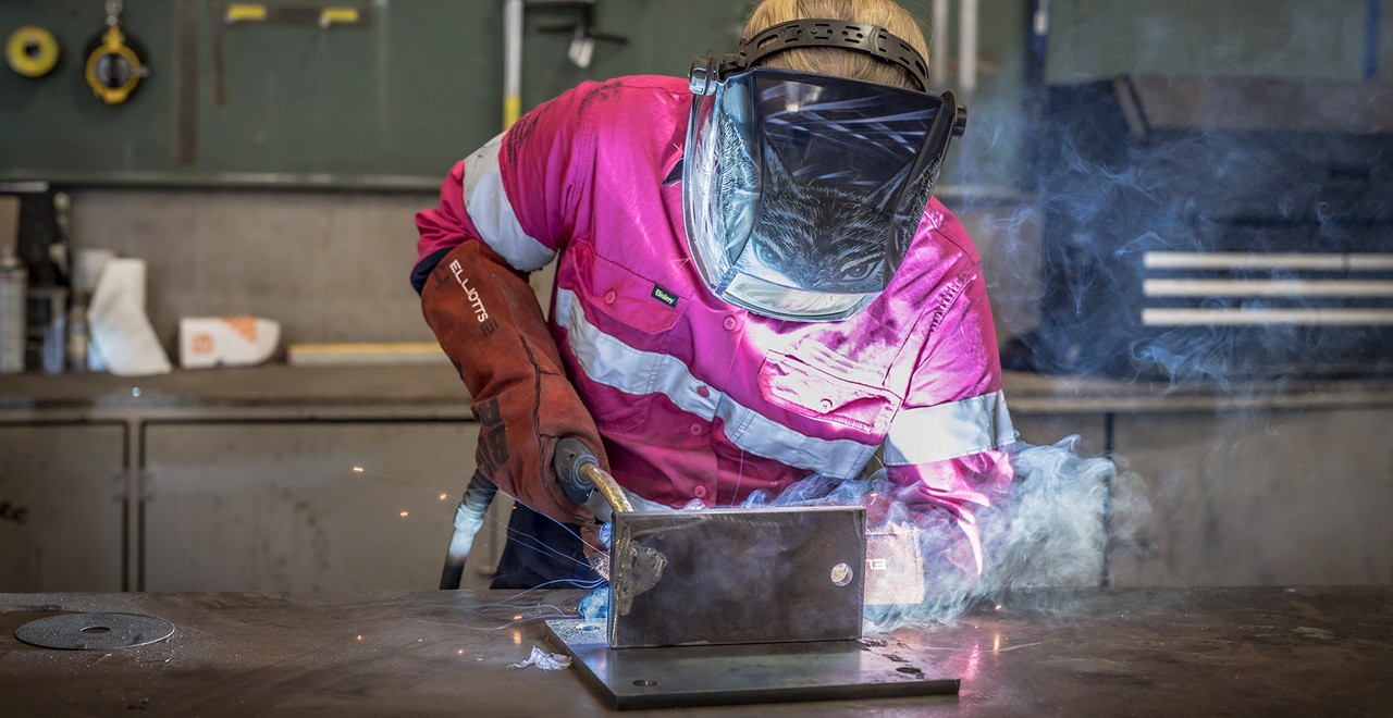 Female welder at work.