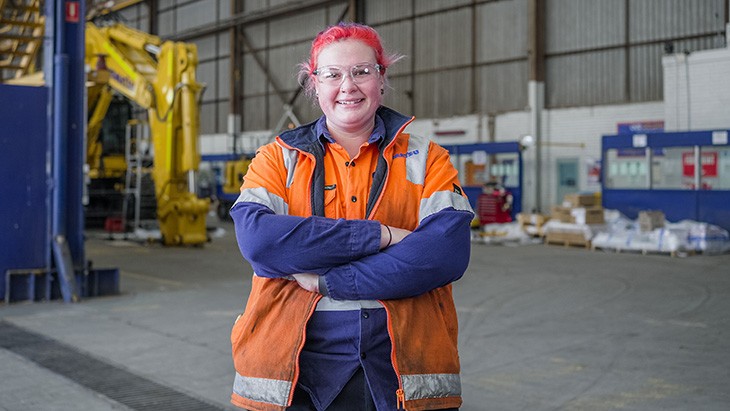 VET female apprentice smiling at the camera