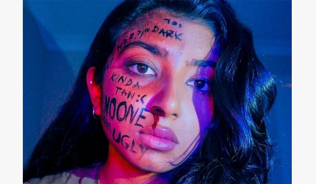 Photo of girl with writing on her face