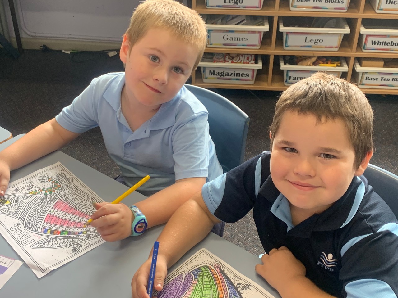 Two students colouring