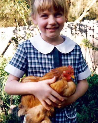 young student holding a hen