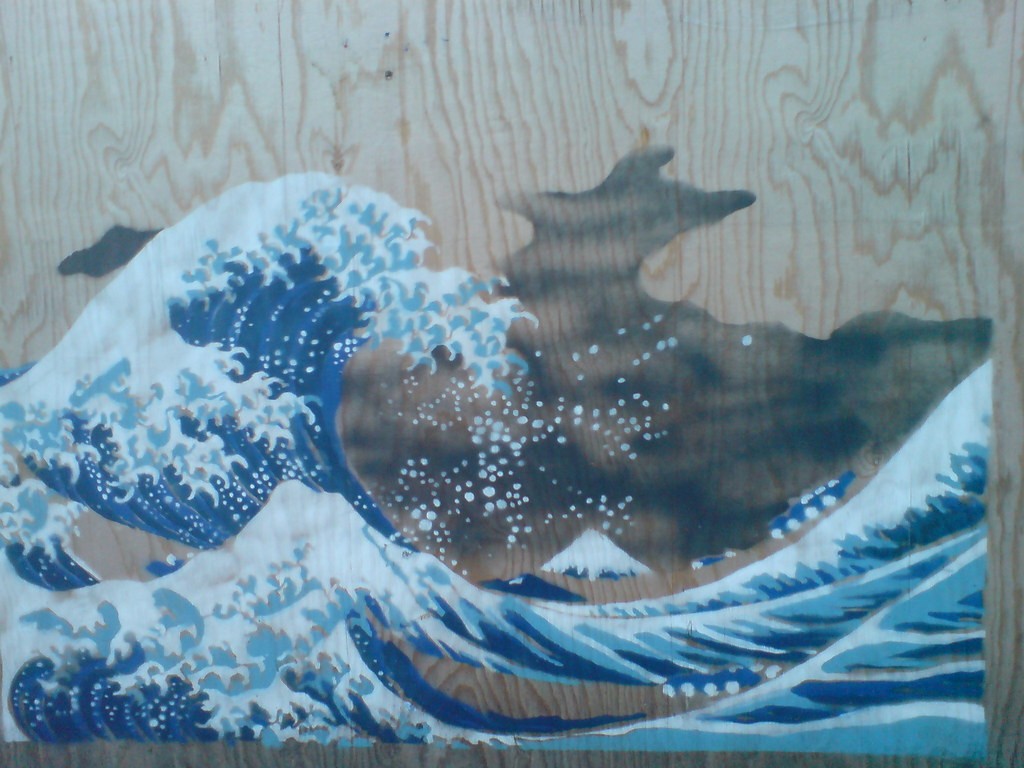 Sample of the great wave printed on plywood in tones of blue.
