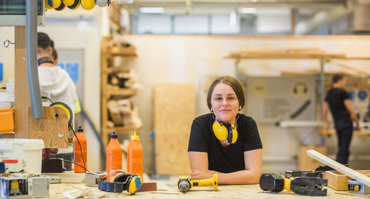 Female apprentice carpenter on work site
