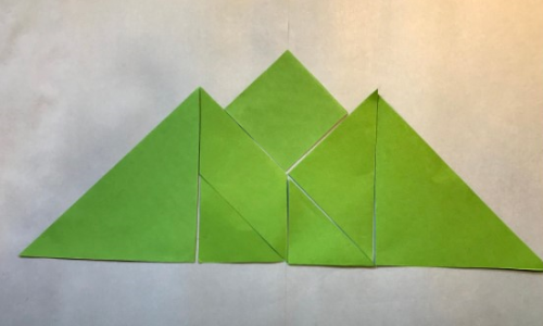 a mountain range made of tangram pieces