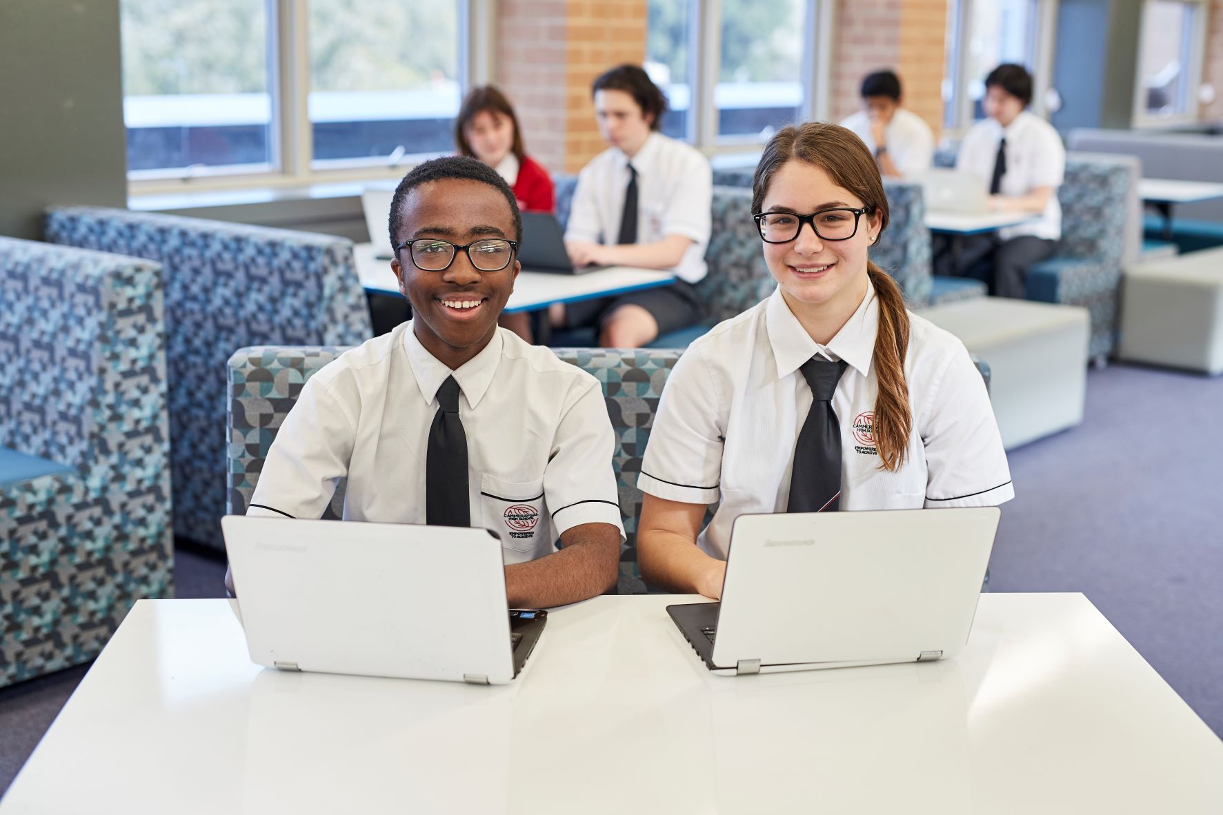 Student using a laptop in the classroom.