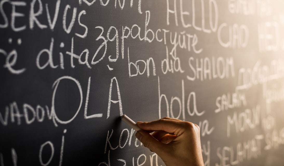 Wriiting difffent language words on chalk board
